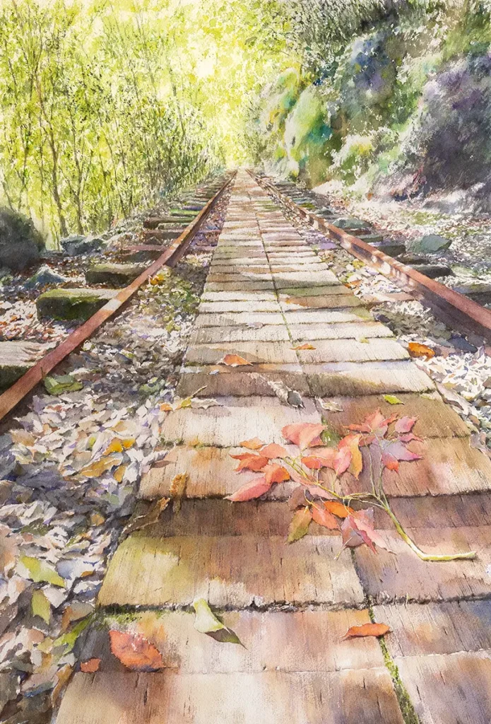 秋の屋久島のトロッコ道と木漏れ日を描いた水彩画